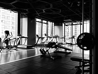 spacious, well-lit interior of Limitless Fitness with workout machines and equipment